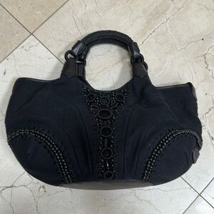 ColeHaaan black handbag.​​​​​​​​​​​​​​​​​